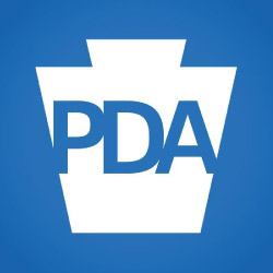 DA department of aging logo in a blue square with a white keystone shape and blue type in the center