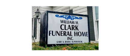 William H Clark Funeral Home sign in front of the business