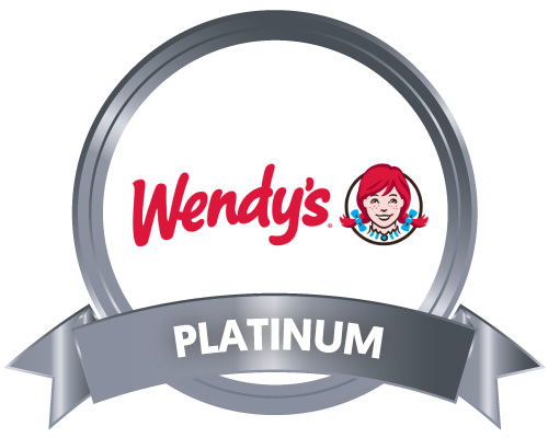 Wendys logo in a metallic gray circle with a metallic gray Platinum Sponsor ribbon at the bottom